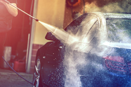 Car washing with pressure water gun.の写真素材