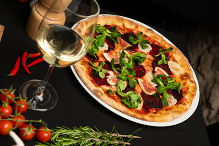 Pizza with beetroot in restaurant. Italian cuisine.の写真素材