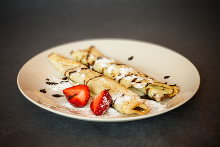 Chocolate pancakes with strawberriesの写真素材