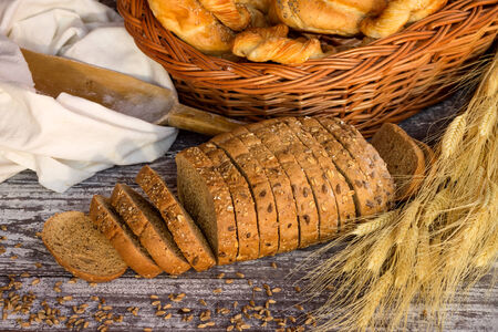 Fresh bread with ear of wheatの写真素材