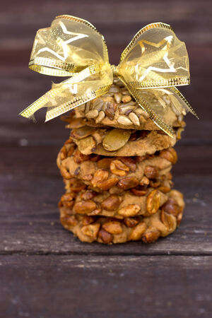 delicious oatmeal cookies with hazelnuts on a wooden tableの写真素材