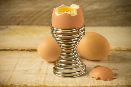 boiled egg on wooden tableの写真素材