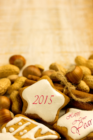 gingerbread cookies on wooden table with nuts and cinnamon for 2015 - Happy New Yearの写真素材