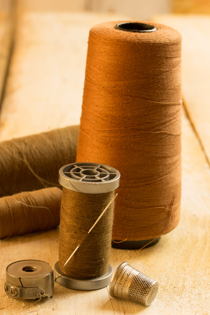 sewing items on a wooden tableの写真素材
