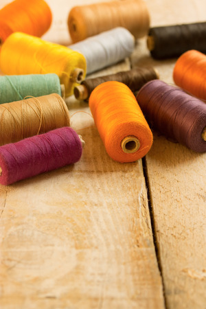 bobbins thread  on vintage tableの写真素材