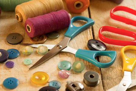 colorful sewing tools on a wooden tableの写真素材