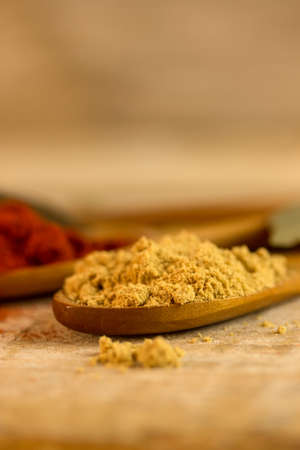 ginger powder spice on a wooden tableの写真素材