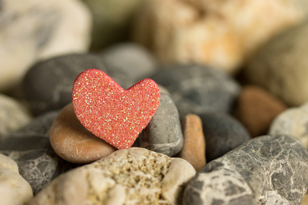 red heart between stonesの写真素材