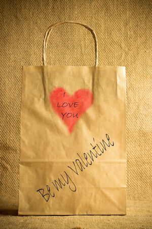 Valentine's gift bag with red heart/ Valentines day backgroundの写真素材