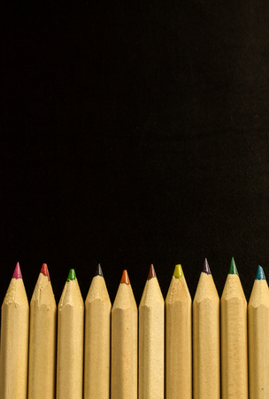 Colorful pencil crayons on a black background, Back to schoolの写真素材