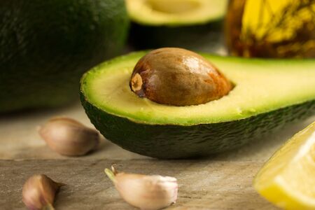 Sliced avocado on a cutting boardの写真素材