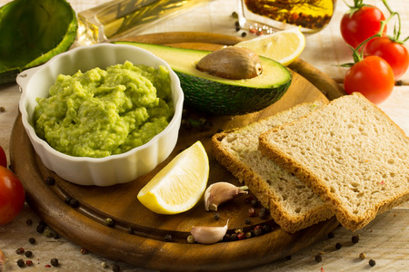 Avocado mousse with halved avocadosの写真素材