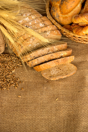 fresh bread and wheat on canvas backgroundの写真素材