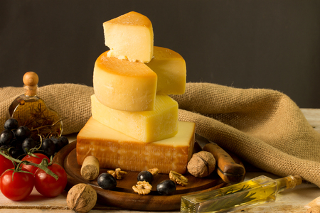 Various types of cheese in an rustic surroundingの写真素材