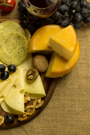 Various types of cheese and red wineの写真素材
