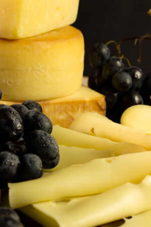 various types of cheese with grapesの写真素材