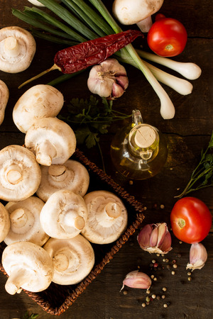 fresh vegetables on a dark wooden tableの写真素材