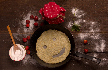 Smiling pancake on a griddleの写真素材