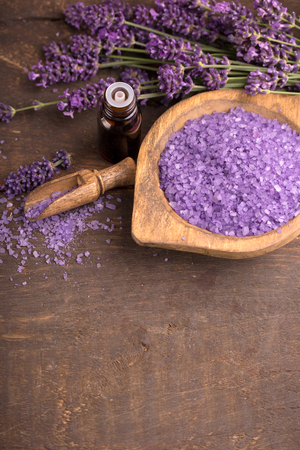 lavender bath salt and oil with lavender flowerの写真素材