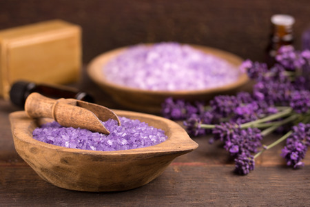 Cosmetic natural product, lavender, oil, aroma salt over wooden backgroundの写真素材