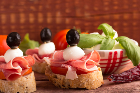 sandwiches with tomato,prosciutto and mozzarellaの写真素材