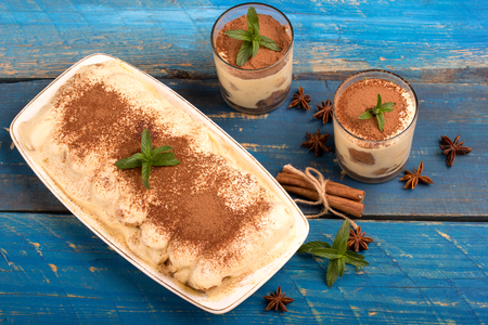 homemade tiramisu on blue wooden tableの写真素材