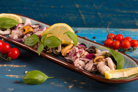 seafood salad with cherry tomato, lemon and basilの写真素材