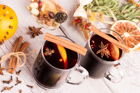 two glasses of mulled wine on white wooden tableの写真素材