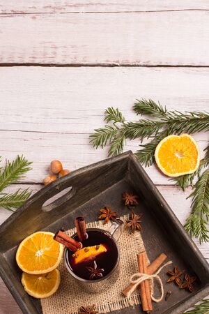 a glass of mulled wine over white wooden backgroundの写真素材