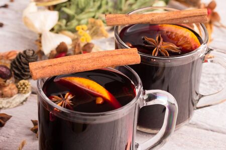 Christmas mulled wine with spices on rusitc tableの写真素材