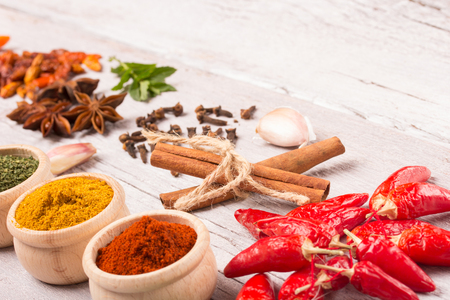 colourful spices on wooden table with free space for your textの写真素材