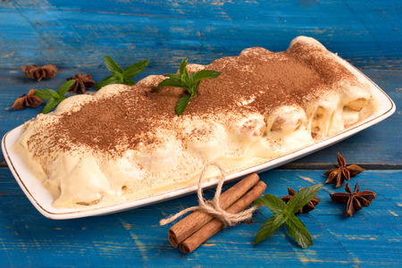tiramisu in a rustic style on a blue wooden tableの写真素材