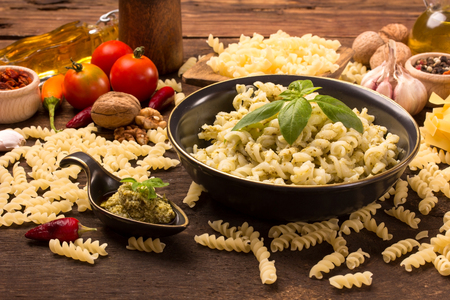 italian fusilli pasta and fresh homemade pesto sauceの写真素材