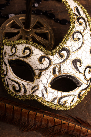 carnival mask on dark wooden backgroundの写真素材