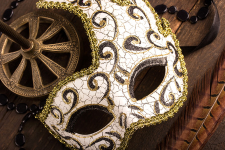 carnival mask over dark wooden backgroundの写真素材