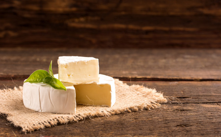 camembert cheese on a canvas in rustic styleの写真素材