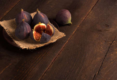 fresh figs over wooden background in a rustic styleの写真素材