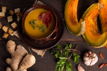 traditional pumpkin soup in a cute ceramic bowlの写真素材