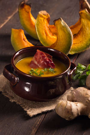 pumpkin soup with bacon in a rustic styleの写真素材