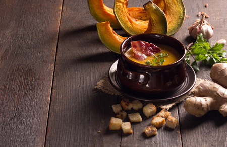 pumpkin soup and baked pumpkins in the backgroundの写真素材