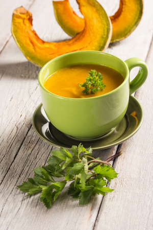Pumpkin soup in a green bowlの写真素材