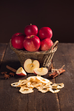 dried apples with beautiful red apples in the backgroundの写真素材