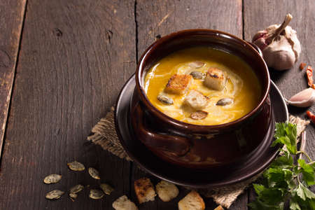 pumpkin soup in a ceramic bowlの写真素材