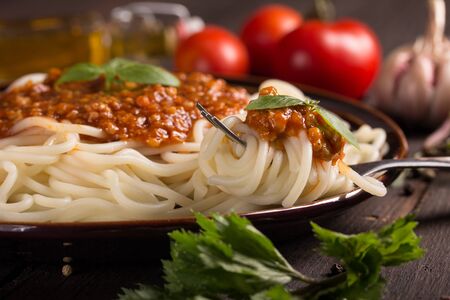 closeup of a plate with spaghetti bologneseの写真素材
