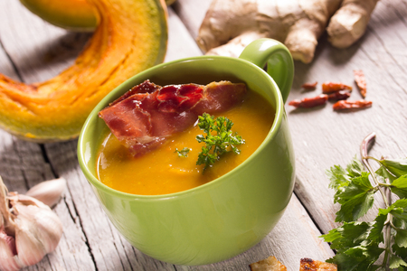 Pumpkin soup in a green bowlの写真素材