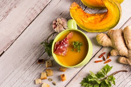 pumpkin soup in green bowlの写真素材