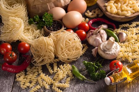 various pastas with herbs and vegetablesの写真素材