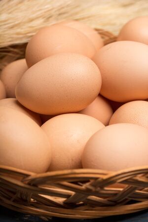 closeup of fresh eggs in a basketの写真素材