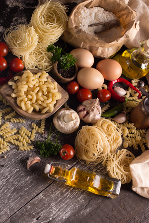 various pastas on wooden surfaceの写真素材