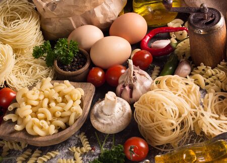 top view of pastas with herbs and vegetablesの写真素材
